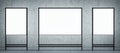 Advertising concept with front view on three blank whiteboards with space for your logo or text on dark grey wall background. 3D Royalty Free Stock Photo