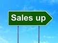 Advertising concept: Sales Up on road sign background