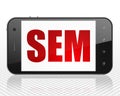 Advertising concept: Smartphone with SEM on display Royalty Free Stock Photo