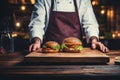 Advertising food hall concept, cooked burger, with a chef in the background.