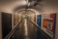 Advertising in passageway linking stations of the Paris Subway.