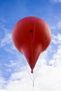 Advertising red air ballon on blu sky Royalty Free Stock Photo