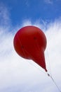 Advertising red air ballon isolated on blu sky Royalty Free Stock Photo