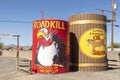 Advertising for Roadkill cafe with slogan you kill it we grill it and Saloon at route 66 at a huge water tank in Seligman, Route Royalty Free Stock Photo