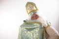 long cloak Saint Nicholas lifted with one hand and wrapped like a superman Sinterklaas portrait USA on a white Royalty Free Stock Photo