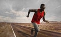 Advertising style portrait of young attractive and fit black African American runner man with athletic body doing running workout Royalty Free Stock Photo