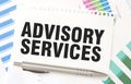 ADVISORY SERVICES on white paper sheet on charts
