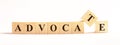 ADVOCATE word made of wooden blocks on a light background. Legal concept Royalty Free Stock Photo