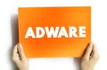 Adware - unwanted software designed to throw advertisements up on your screen, text concept on card Royalty Free Stock Photo