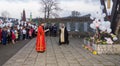 Orthodox priest makes a memorial service and people with white balloons on the day of mourning for those killed in a fire in Kemer