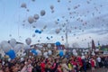 People are launching into the sky white balloons on the day of mourning for those killed in a fire in the city of Kemerovo