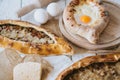 Adzharian khachapuri with egg and traditional turkish pide with meat Royalty Free Stock Photo