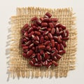 Adzuki Bean legume. Close up of grains over burlap. Royalty Free Stock Photo