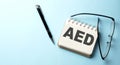 AED - Add, Edit and Delete text is written on a notepad on the blue background Royalty Free Stock Photo