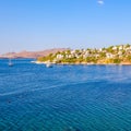 Aegean coast with marvelous blue water, rich nature, islands, mountains and small white houses