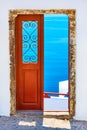 Aegean sea through the open door in Santorini, Royalty Free Stock Photo