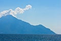 Aegean sea, silhouette of the holy mountains Athos and a small cloud above the mountain top