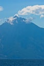 Aegean sea, silhouette of the holy mountains Athos and a small cloud above the mountain top