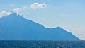 Aegean sea, silhouette of the holy mountains Athos and a small cloud above the mountain top