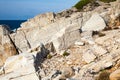 Aegean seashore and marble rocks in Aliki, Greece Royalty Free Stock Photo