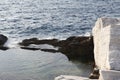 Aegean seashore and marble rocks in Aliki Royalty Free Stock Photo