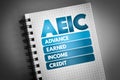 AEIC - Advance Earned Income Credit acronym on notepad, business concept background