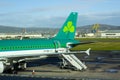 An Aer Lingus jet with livery sits on the apron at Belfast City