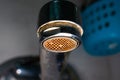 aerator diffuser in the faucet close-up. Corrosion and scale deposits from water. Dirty old water faucet in the washbasin on a