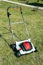 Aerator standing in grass. Royalty Free Stock Photo