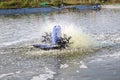 Aerator and turbine water in shrimp pool Royalty Free Stock Photo