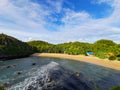 Aereal view of the lagoon sand beach Kasap with green hills.