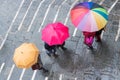 Aereal view of people holding colorful umbrellas