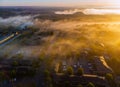 Aeria eye view houses in sleep area in beautiful view of the river from a height at dawn with fog morning