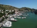 Aerial panoramic view of Balaklava landscape with boats and sea in marina bay. Crimea Sevastopol tourist attraction