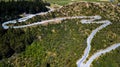 Aerial above view of a curvy serpentine road, New Zealand Royalty Free Stock Photo