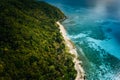 Aerial above view of lonely boat moored at secluded remote tropical uninhabited island with white sand beach, coconut Royalty Free Stock Photo