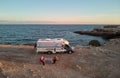 Couple near camper and view to the Mediterranean Sea