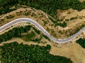 Aerial above view of a rural landscape with a curvy road running through it in Greece. Royalty Free Stock Photo