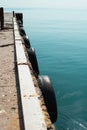 Abstract view of a marina wooden pier in a shallow turquoise sea water.Sparse composition with lots of space Royalty Free Stock Photo