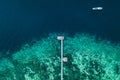 Aerial abstract view of wooden boat pier on tropical island with coral reef Royalty Free Stock Photo