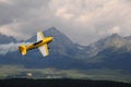 Aerial acrobatics in mountains - weer airplane Royalty Free Stock Photo