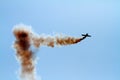 Aerial acrobatics plane in the cloud of smoke Royalty Free Stock Photo