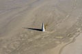 Aerial apocalyptic scene, church tower with cross buried under mud and toxic copper mining residuals Royalty Free Stock Photo