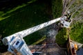Meridian, Idaho, USA Ã¢â¬â April 8, 2020: Aerial arm allows a tree cutter to remove the top of a tree