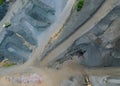 Aerial of asphalt and cement factory large piles of construction rocks used for asphalt production heavy machinery ready to work