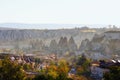 Aerial autumn landscape view of ancient Goreme. It is famous cave town in Cappadocia. Picturesque cityscape with light fog