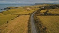Aerial autumn road: car travel view. Beautiful Northern Ireland countryside nature scene Royalty Free Stock Photo