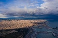 Aerial Barcelona panorama before storm. City with shadows from clouds. Moody weather. Spring in Barcelona Spain
