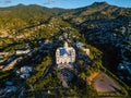 Aerial of the Basilica of Our Lady of Suyapa in Tegucigalpa, Honduras with hills in the background