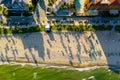 Aerial beach photo at dusk long palm tree shadows